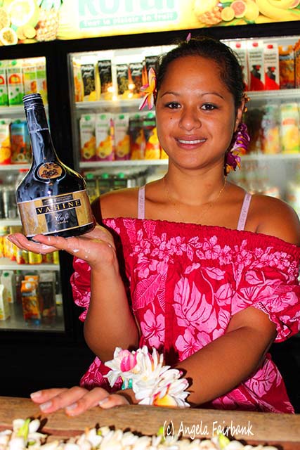 Girl at juice factory, Moorea, French Polynesia, copyright Angela Fairbank