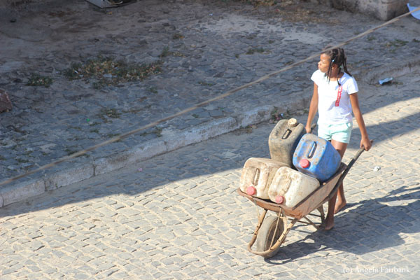 girl with wheel barrow