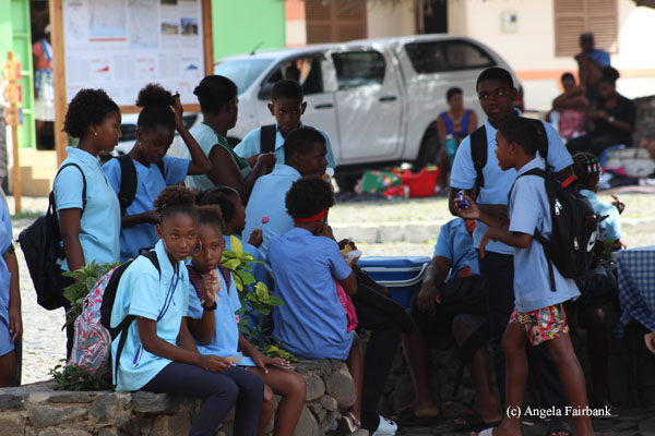 school children waiting for bus