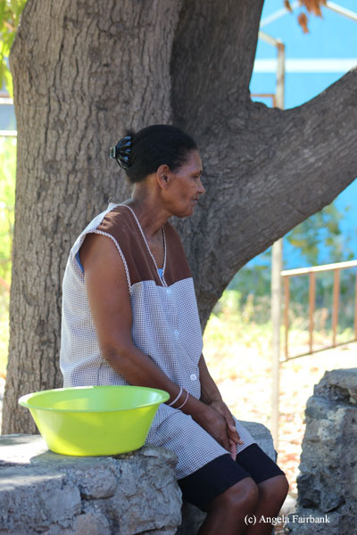 woman sitting under tree