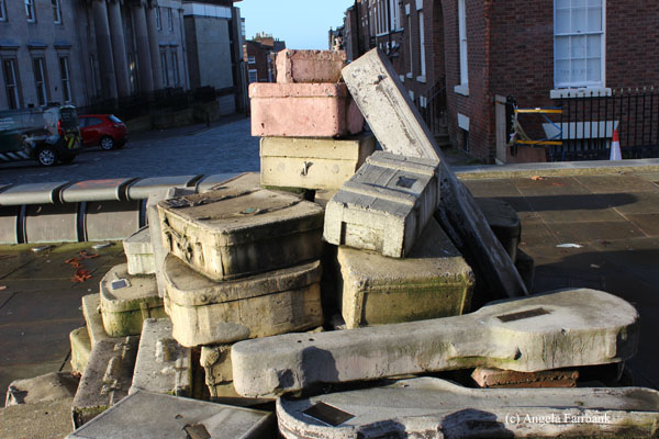 statue of suitcases